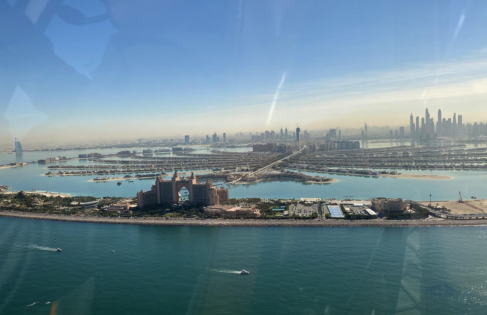 the view over dubai palm jumeirah from helicopter